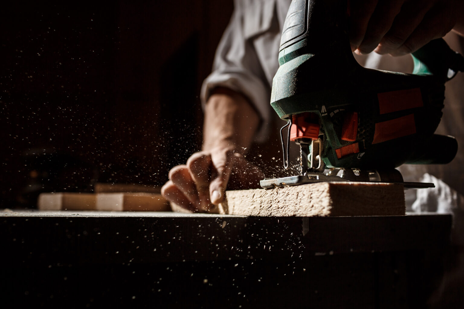 Close up photo of cutting wood with fretsaw