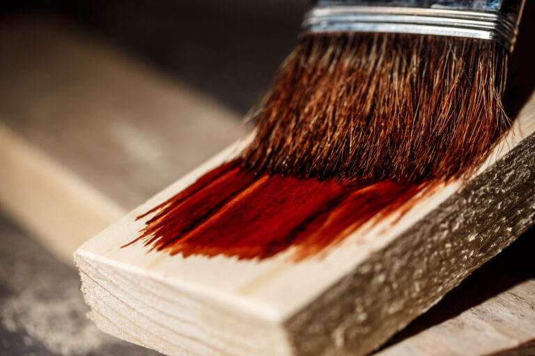 Close up photo of painting wood in brown color